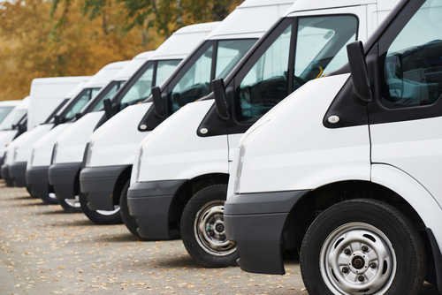 Commercial,Delivery,Vans,In,Row,At,Parking,Place,Of,Transporting
